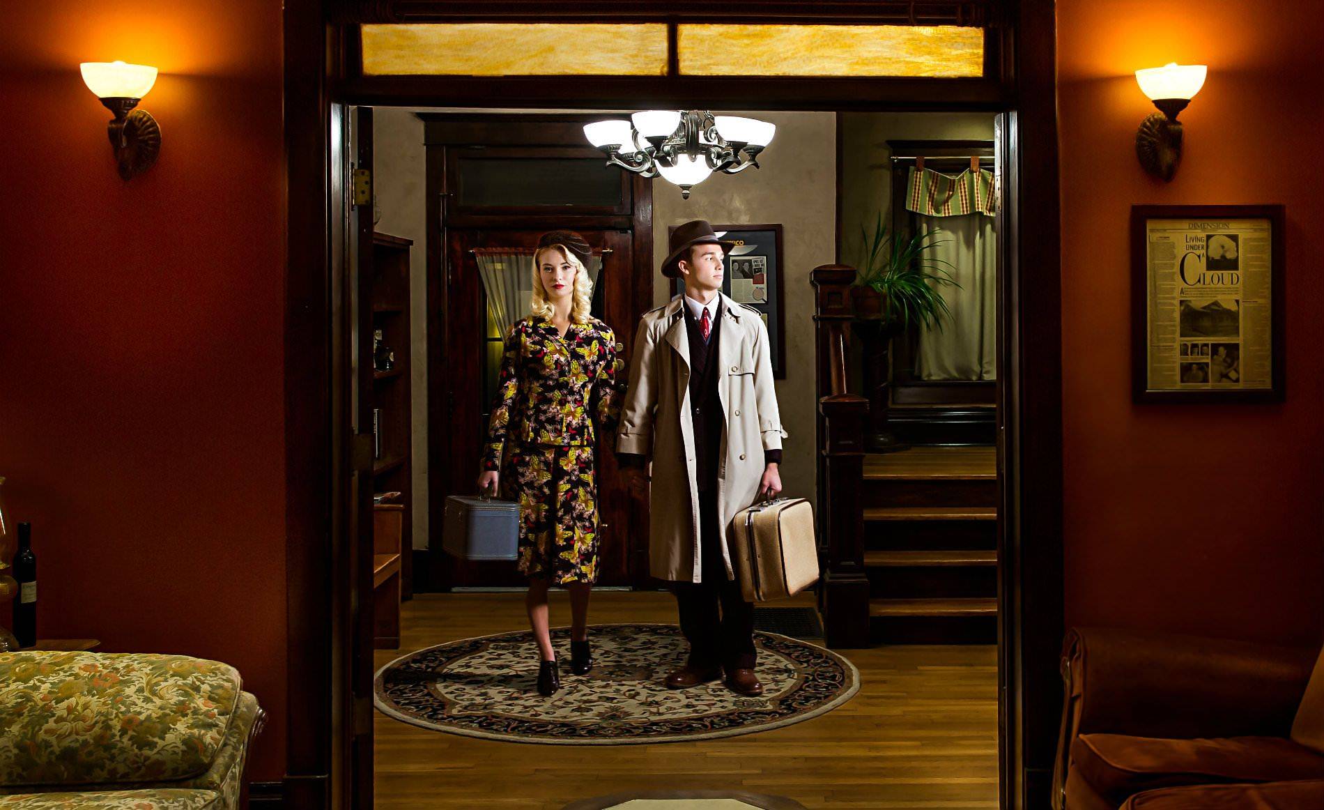 A couple standing in the doorway ready to check-in.